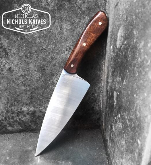Nicholas Knives handcrafted chef's knife with wooden handle, versatile kitchen tool for Southeast entrepreneurs.